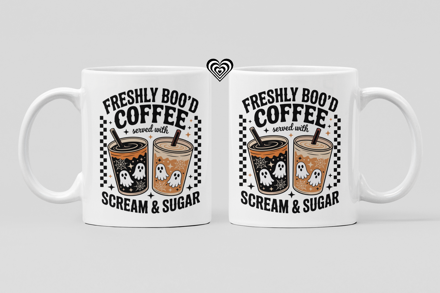 Two white mugs with Halloween-themed coffee design on a light gray background