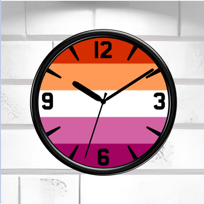 Wall clock with a colorful striped lesbian pride flag design on a white brick wall background