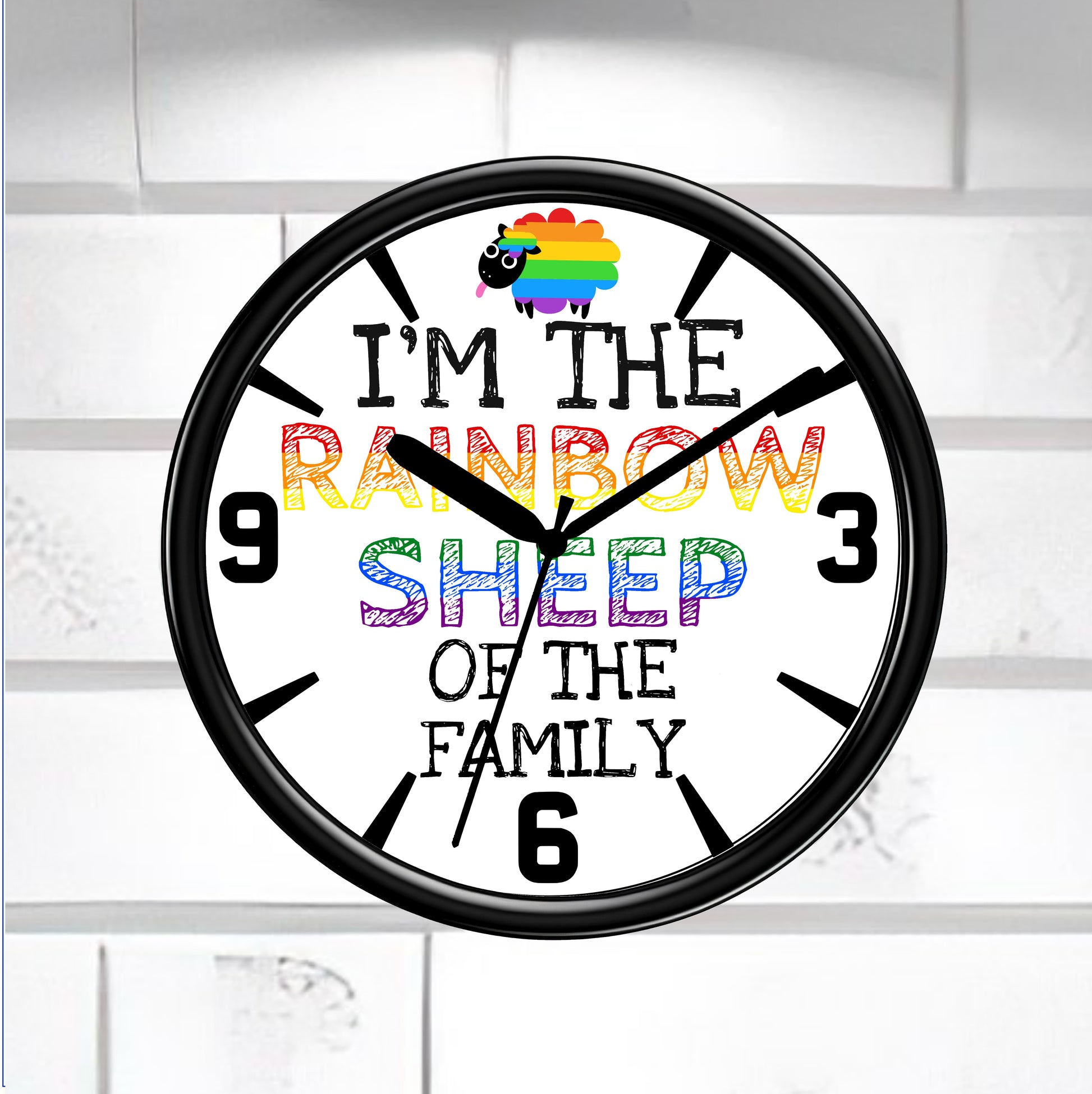 Wall clock with rainbow sheep design and text on a white brick wall background