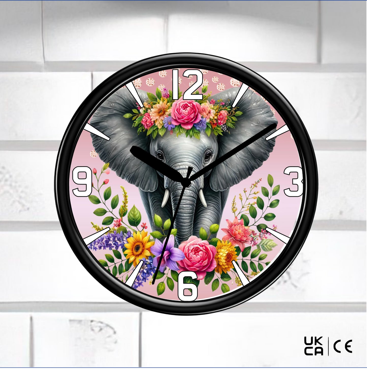 Black Wall Clock on a white tile background, clock face is an elephant with flowers