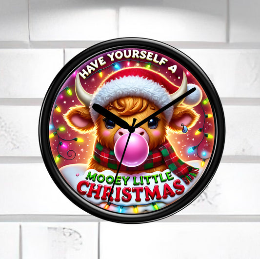 Wall clock with a festive design featuring a cow wearing a Santa hat and text 'Have Yourself a Mooey Little Christmas' on a white brick wall background.