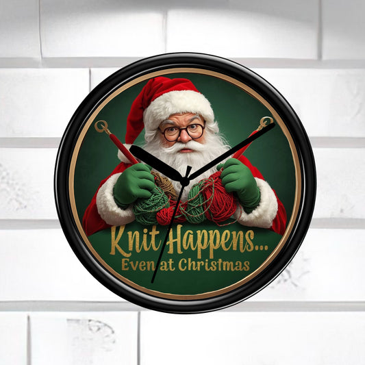 Wall clock with Santa Claus holding knitting materials and text 'Knit Happens... Even at Christmas' on a white background.