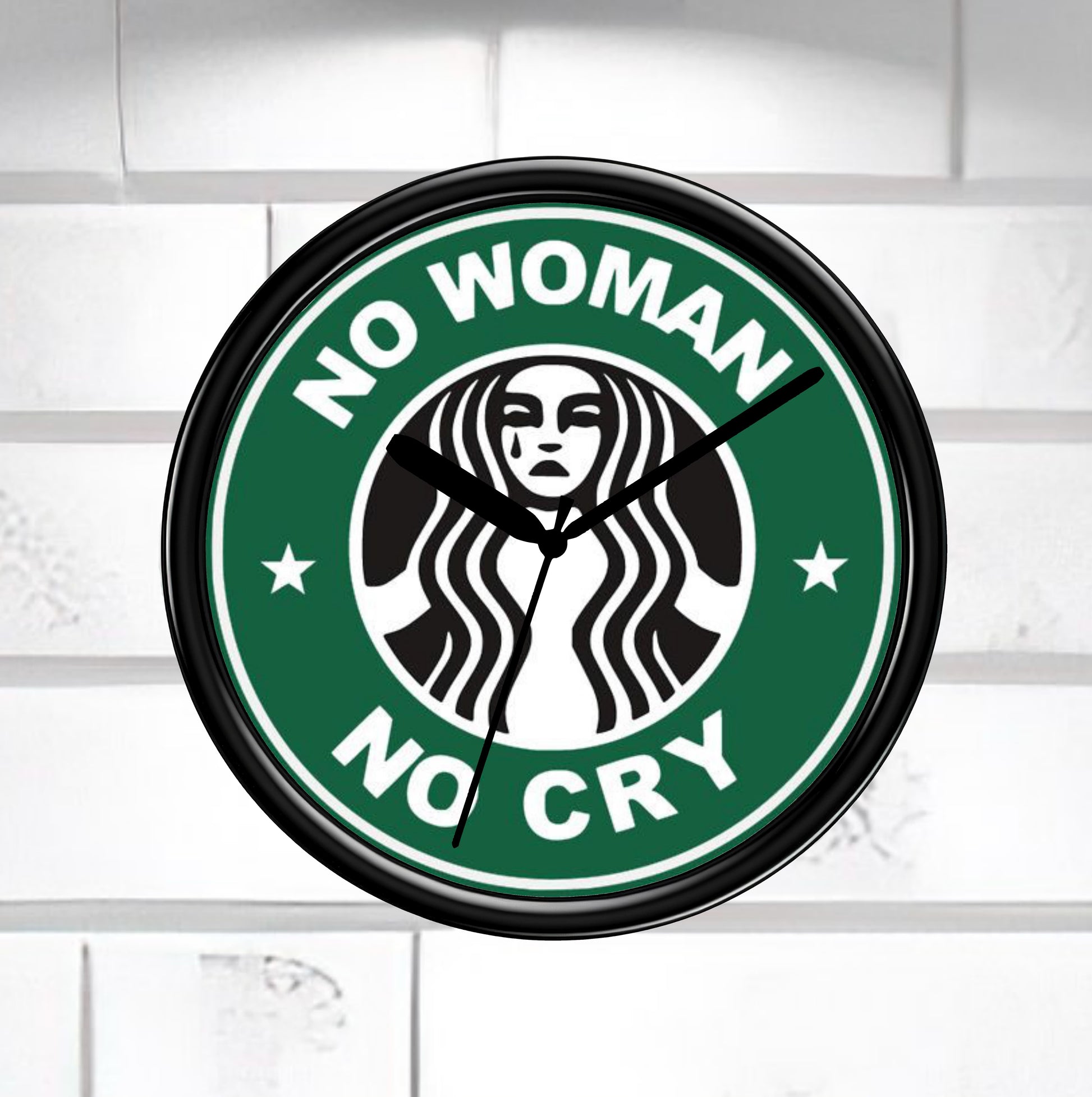 Wall clock with 'No Woman No Cry' design on a white background