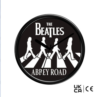 Wall clock with The Beatles Abbey Road design on a black background