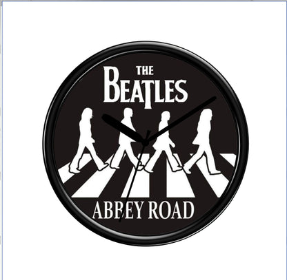 Wall clock with The Beatles Abbey Road design on a black background