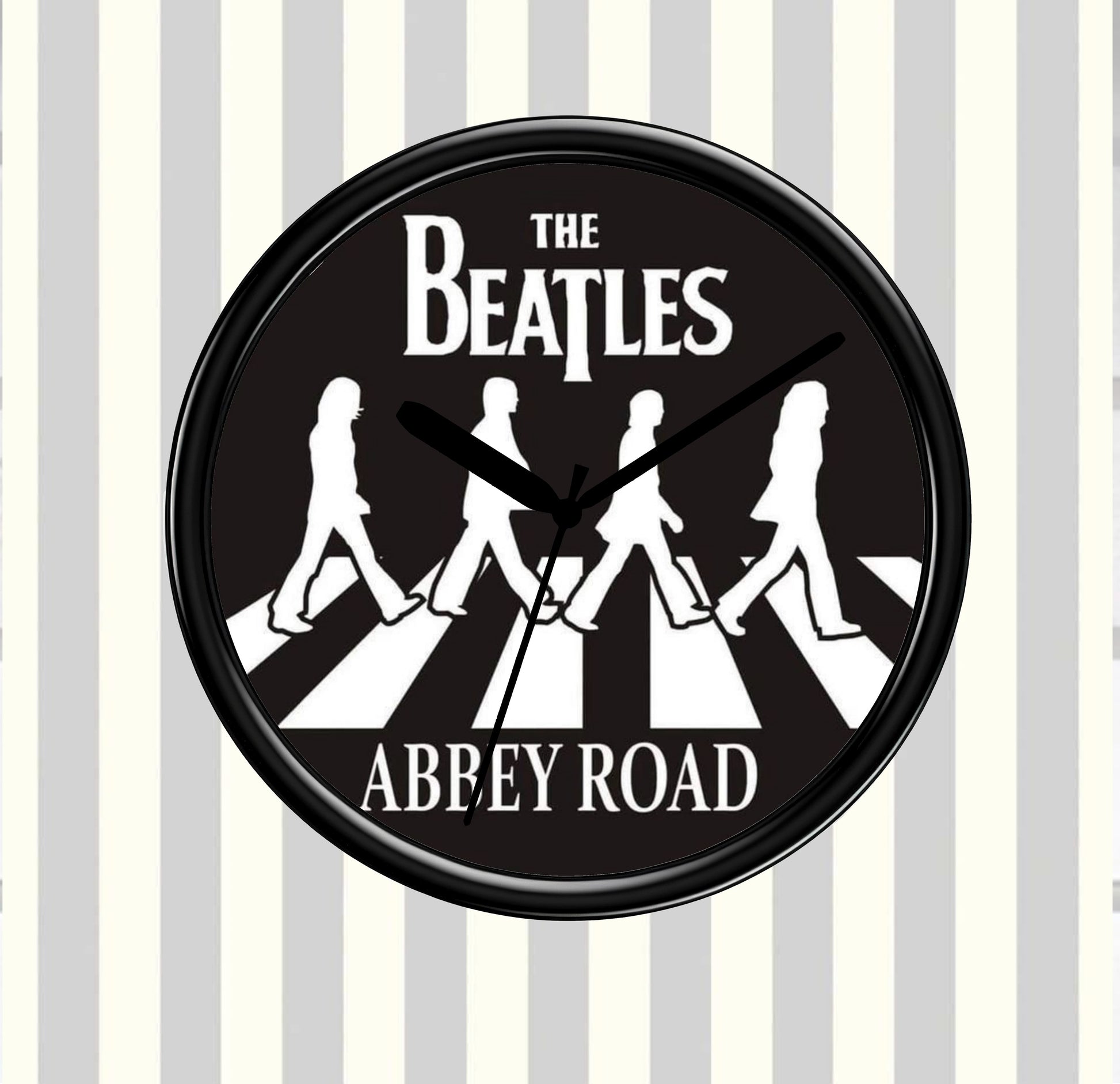 Circular clock with The Beatles Abbey Road design on a striped background