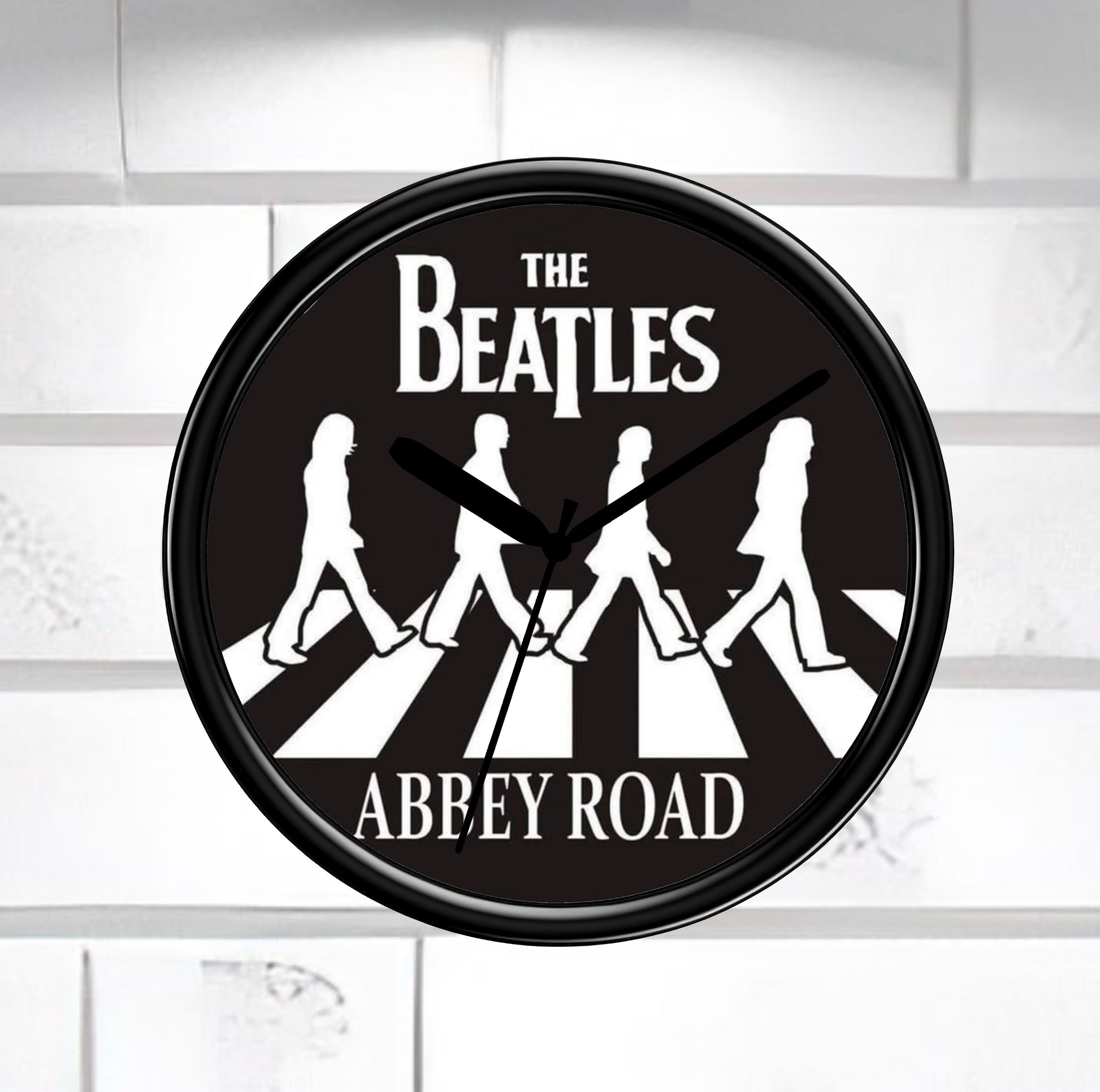 Wall clock with The Beatles Abbey Road design on a white background