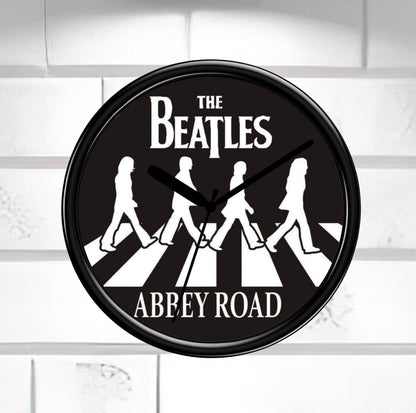 Wall clock with The Beatles Abbey Road design on a white background