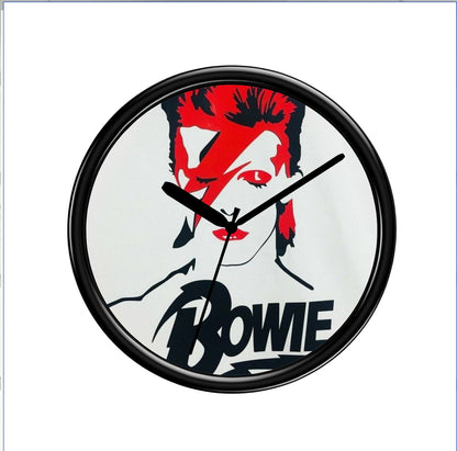 Wall clock with a design of a famous person's face and the name 'Bowie' on a white background.