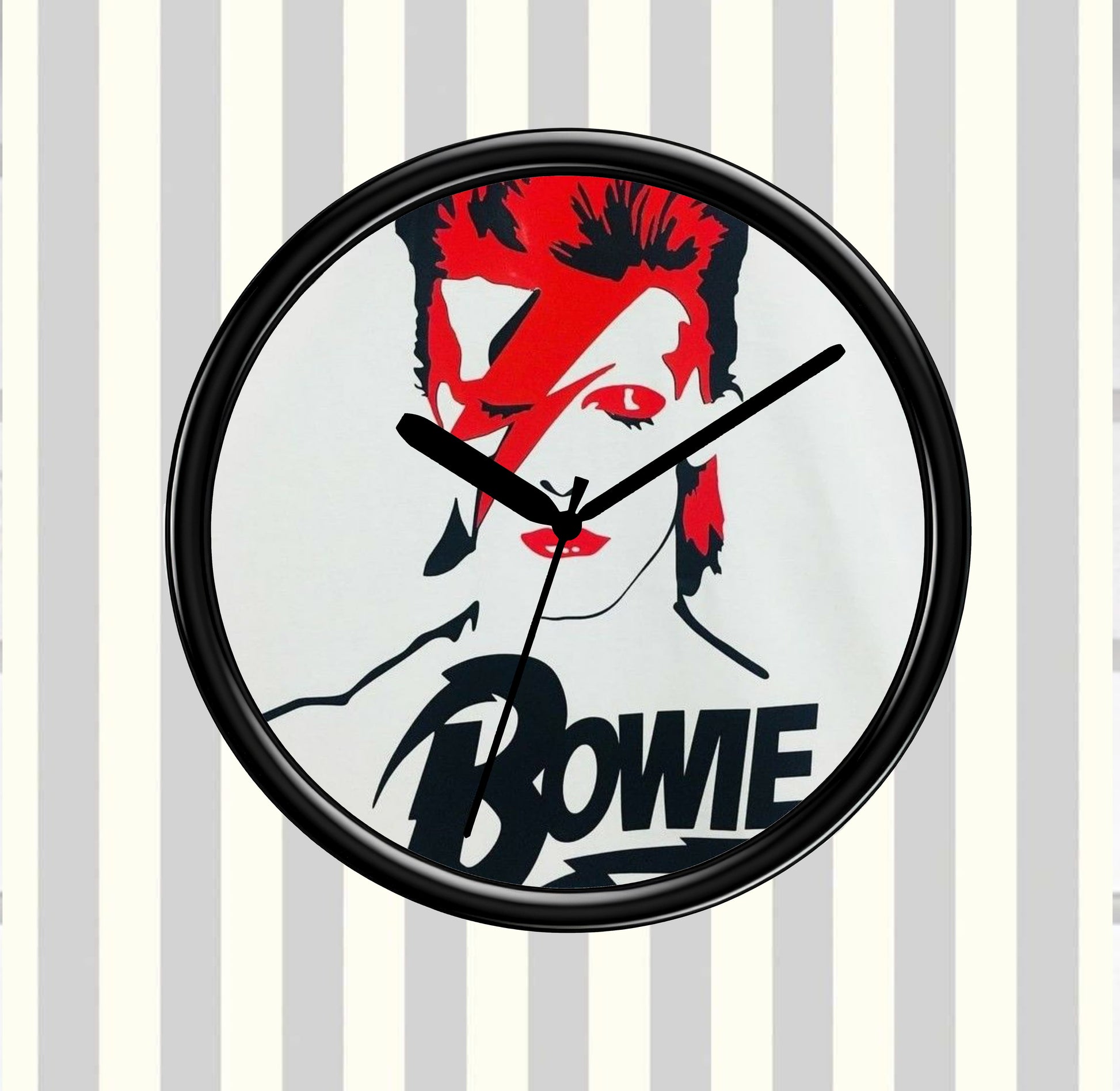 Wall clock with a design of a famous person's face and the name 'Bowie' on a striped background