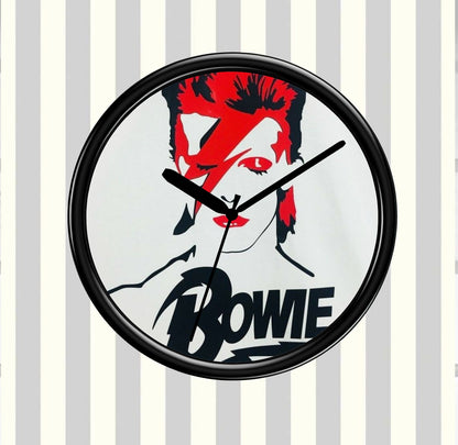 Wall clock with a design of a famous person's face and the name 'Bowie' on a striped background
