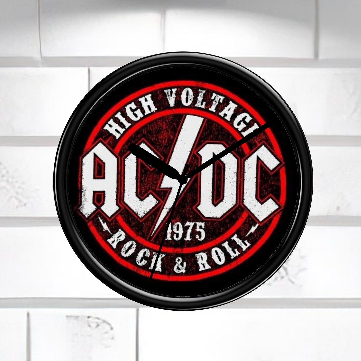 AC/DC wall clock with red and black design on a white background