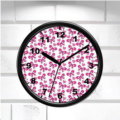 Wall clock with pink bow pattern on a white brick wall background