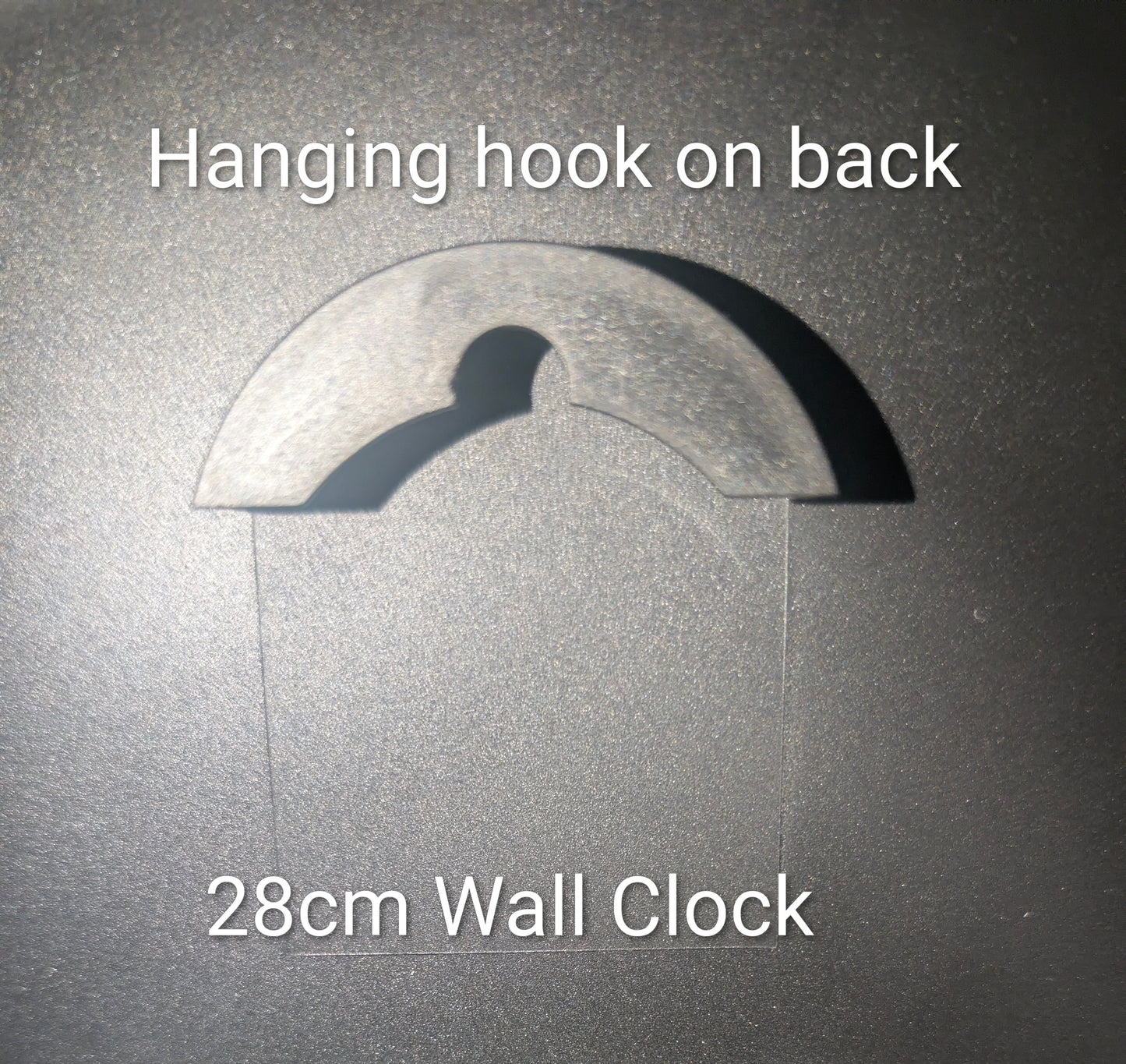 A wall clock shown against a dark textured background with overlaid text reading 'Hanging hook on back' and '28cm Wall Clock', indicating the back of the clock has a hanging hook and the clock diameter is 28 cm.