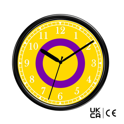 Yellow wall clock with purple center and black frame on a white background