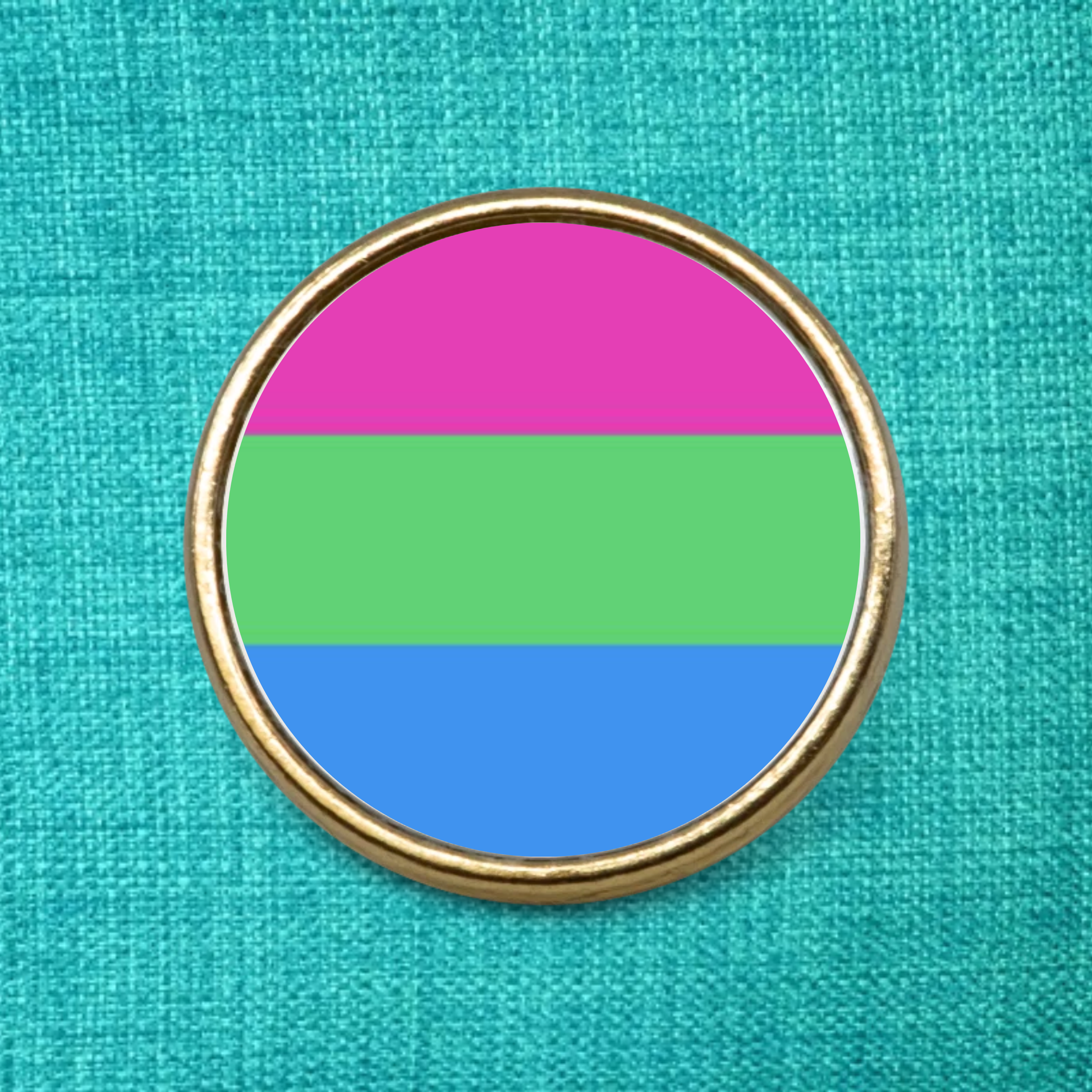 Gold Lapel Pin Badge on a green textured background featuring the Polysexual Pride Flag