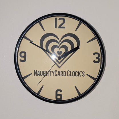 Front view of Black plastic wall clock on a plain white background - Wall clocks from NaughtyCard.co.uk