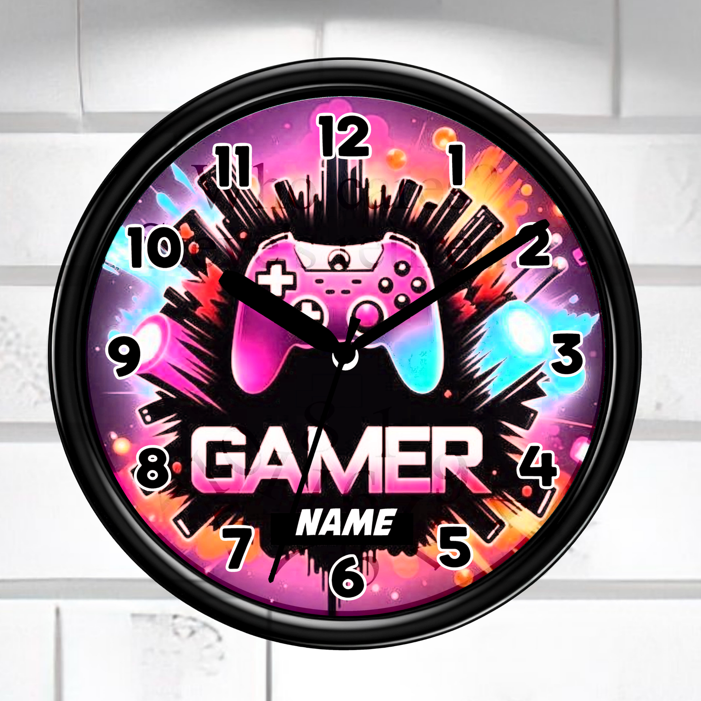 Gaming-themed wall clock with colorful design and 'Gamer' text on a white brick wall background.