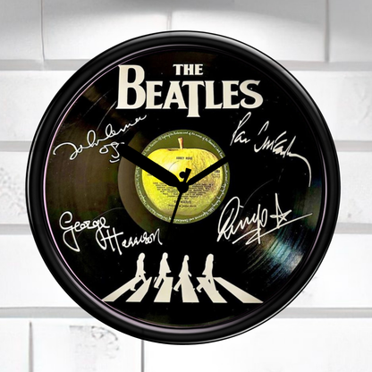 Wall clock featuring The Beatles' Abbey Road album cover with signatures on a white background