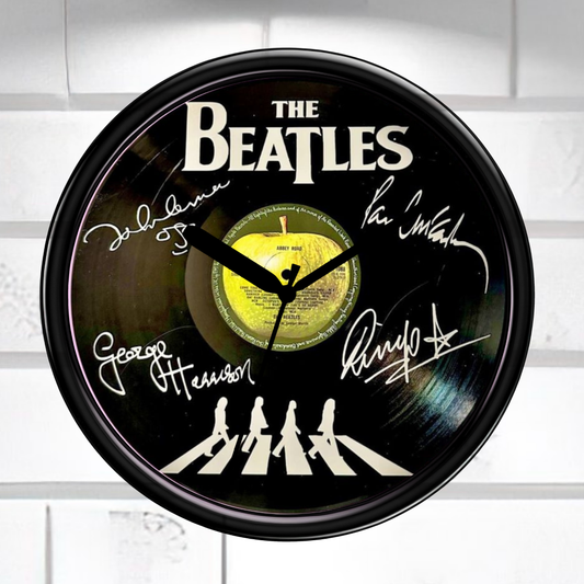 Wall clock featuring The Beatles' Abbey Road album cover with signatures on a white background