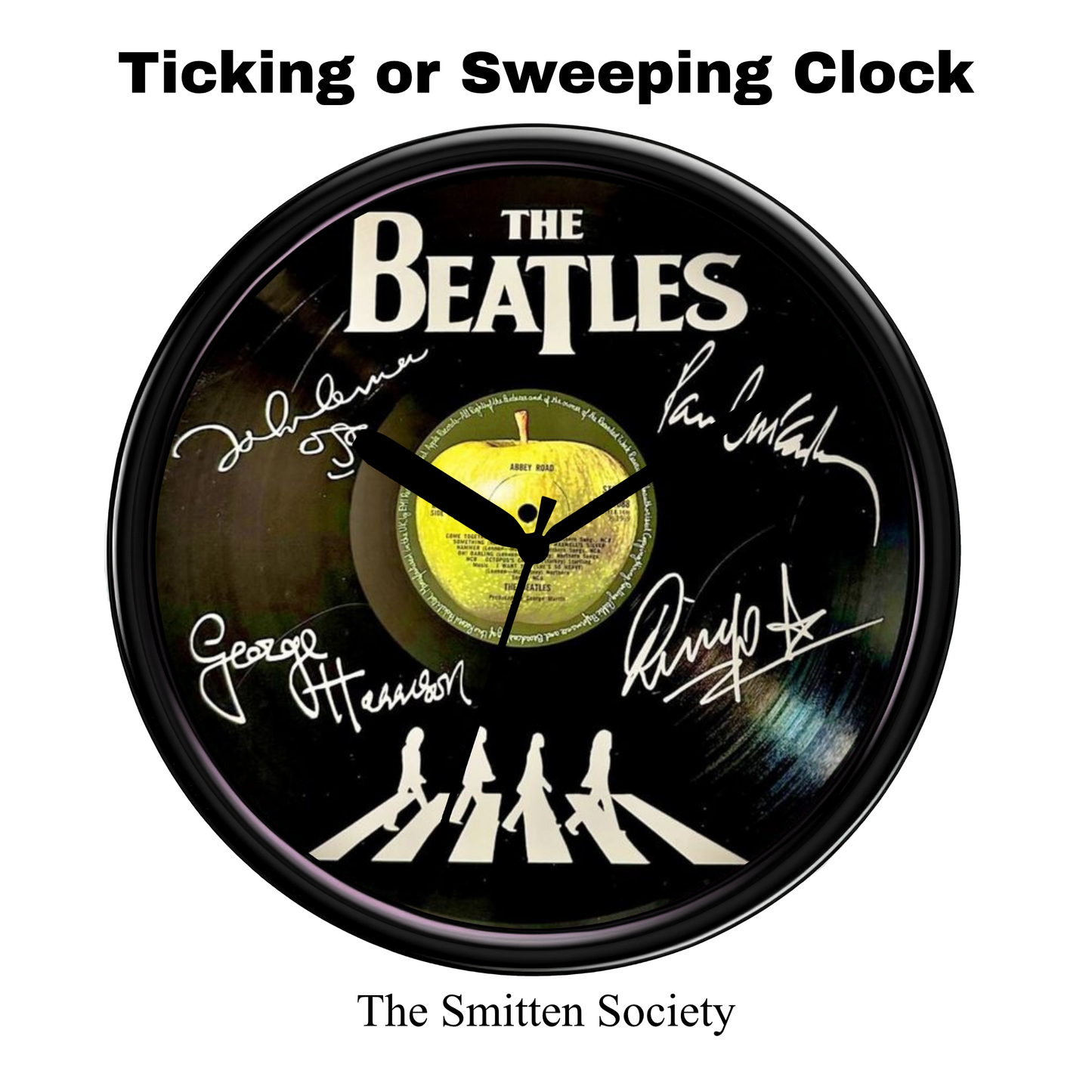 Clock with The Beatles' signatures and Abbey Road album cover design on a white background