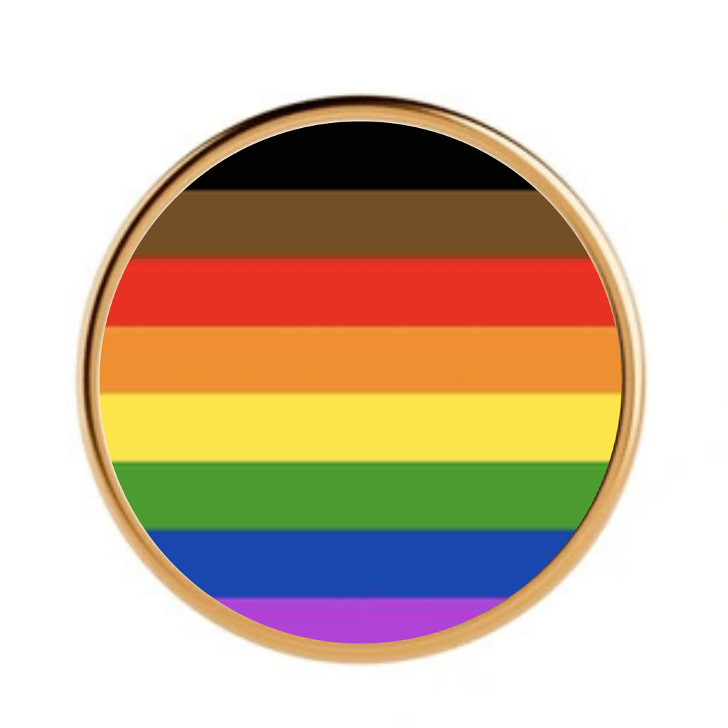 Person of colour inclusive pride flag on a gold metal pin badge