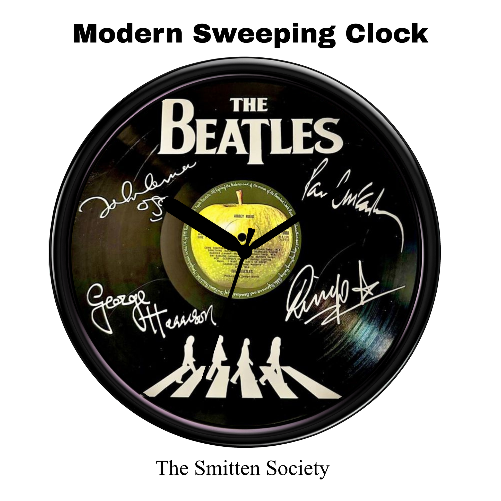 Wall clock with The Beatles Abbey Road album cover design on a white background