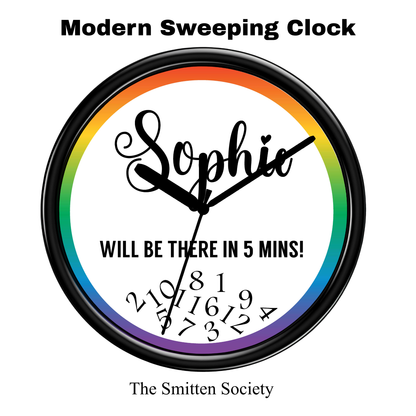 Wall clock with rainbow gradient and text 'Sophie WILL BE THERE IN 5 MINS!' by The Smitten Society.