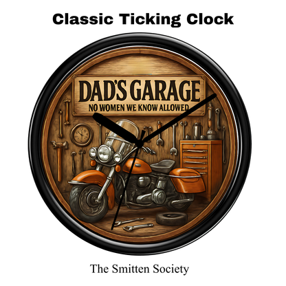 Wall clock with 'Dad's Garage' theme featuring a motorcycle and tools, branded 'The Smitten Society'.
