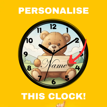 A personalized teddy bear wall clock with a black frame, shown against a bright yellow background with the text 'PERSONALISE THIS CLOCK!' and a red arrow pointing to the clock face.