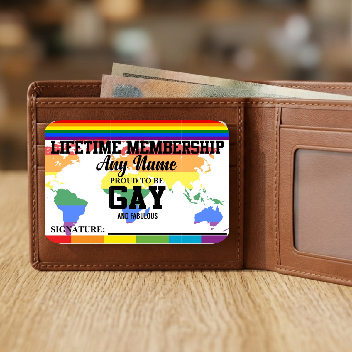 Brown wallet with a Gay Membership card inside on a wooden surface