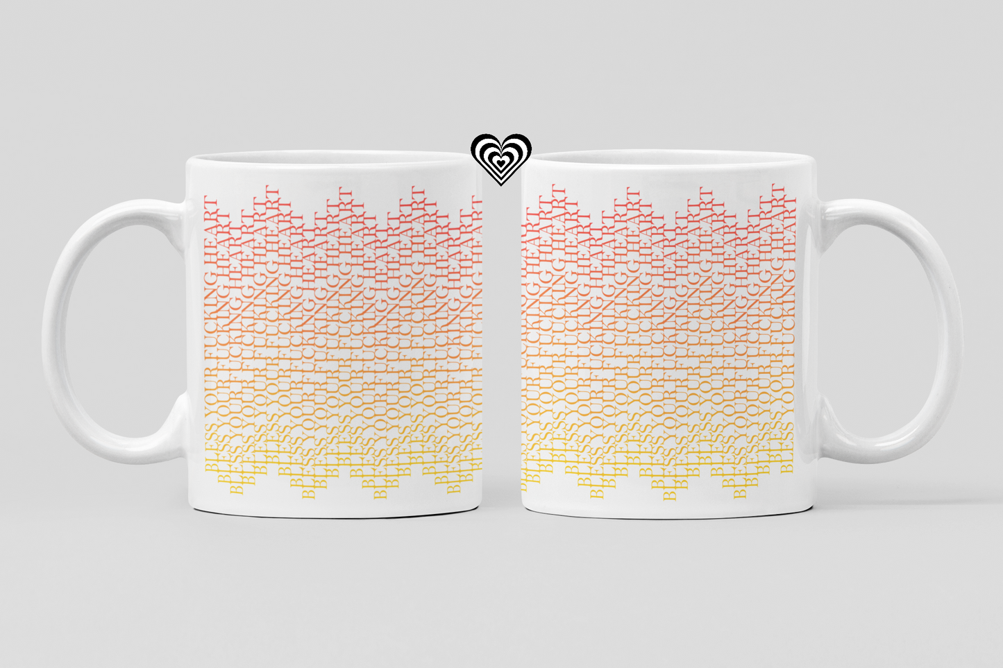 Two white mugs with colorful geometric pattern on a light gray background