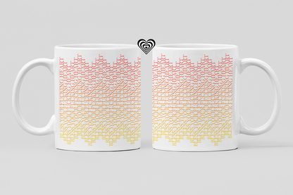 Two white mugs with colorful geometric pattern on a light gray background