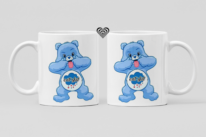 Two white mugs with blue cartoon naughty bears and 'eat sh*t' text on a light gray background