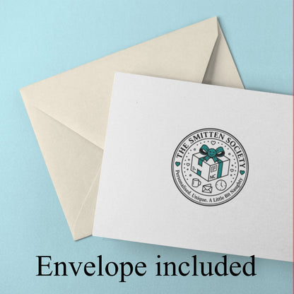 Envelope included, White card with a logo and beige envelope on a light blue background