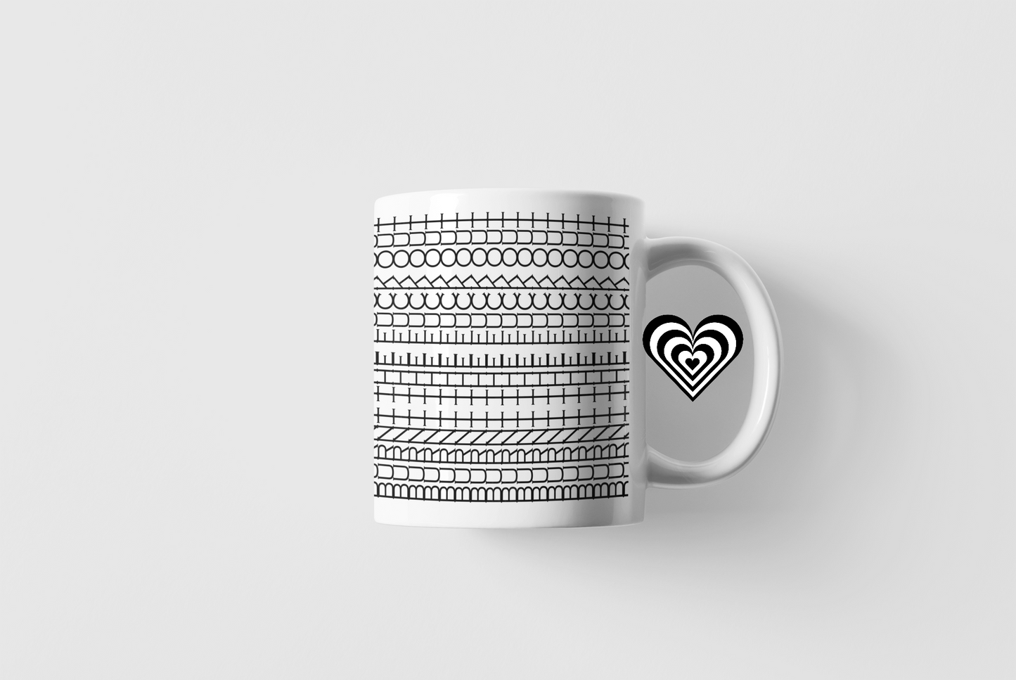 Rude Swearing White mug with black pattern on a light grey background.