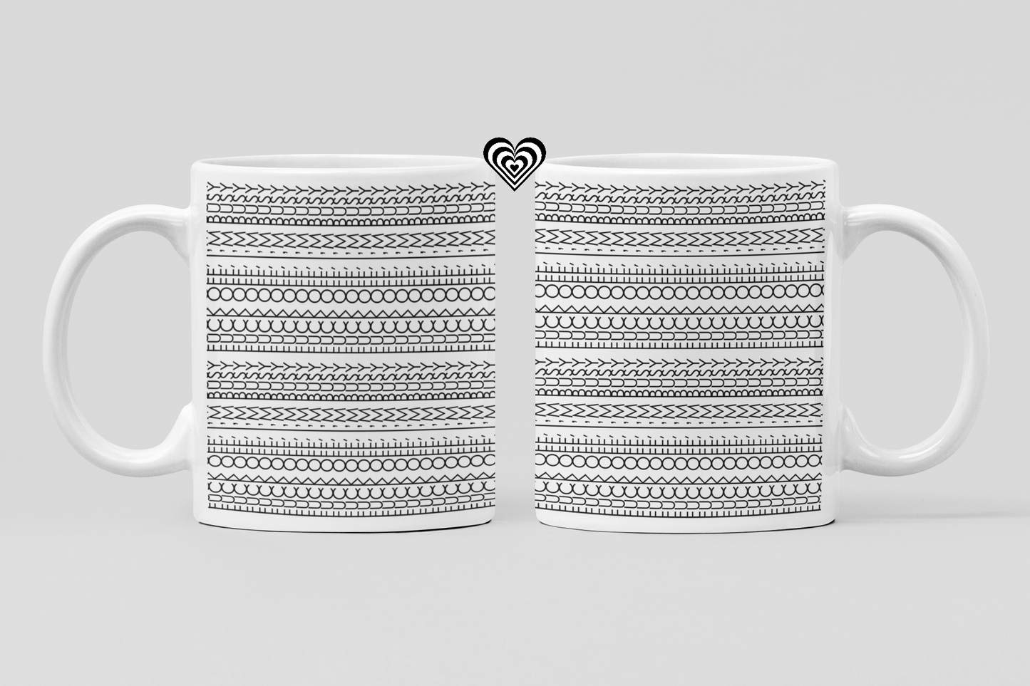 White mug with black geometric pattern on a light gray background