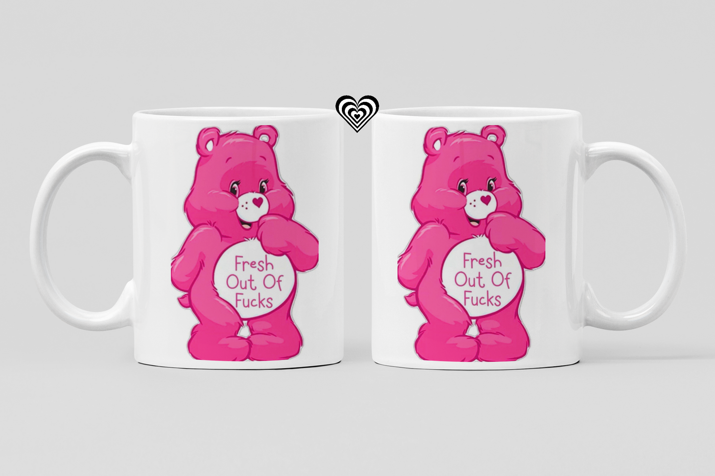 Two white mugs with pink cartoon naughty bears and 'fresh out of fu*ks' text on a light gray background