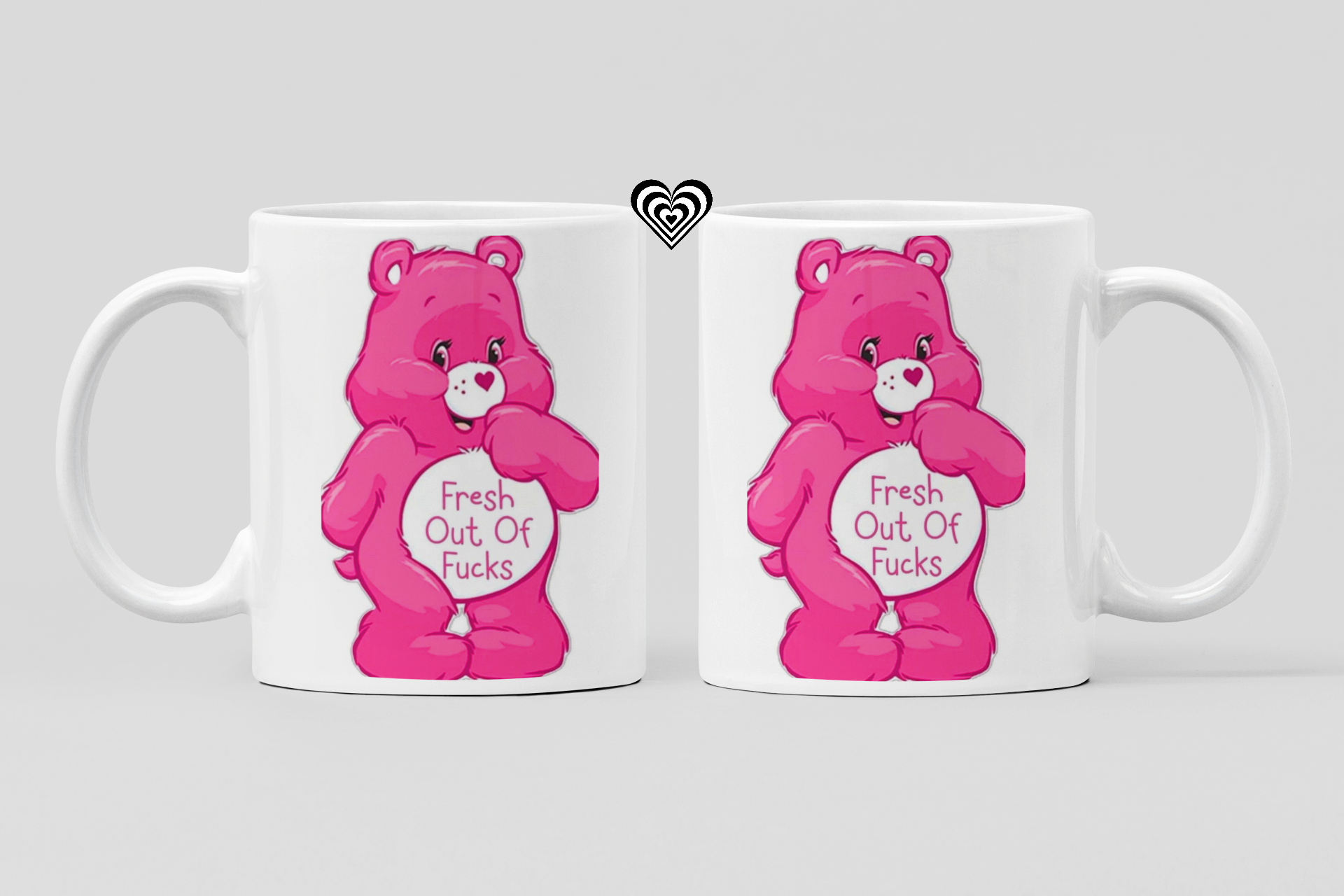 Two white mugs with pink cartoon naughty bears and 'fresh out of fu*ks' text on a light gray background