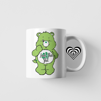 Mug with a green naughty bear design and 'fu*k this sh*t' text on a white background