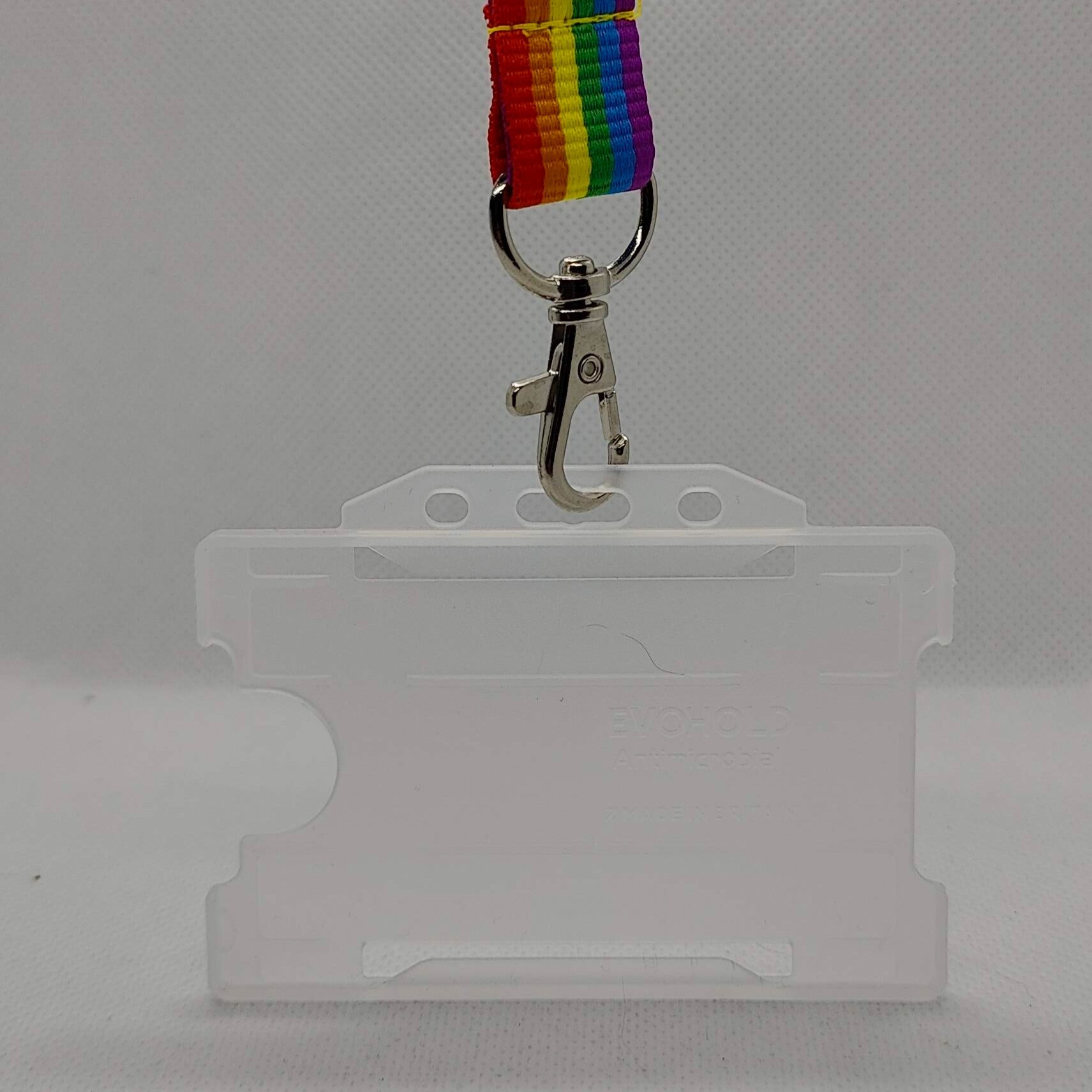 Gay Pride lanyard and card holder on a plain white background
