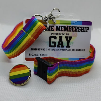 A colorful lanyard and card holder with a 'MEMBERSHIP' card featuring text and a rainbow pattern, along with a circular badge with a rainbow and the text 'Gay'. The card and badge are presented on a white background.
