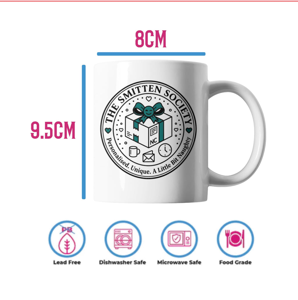 White ceramic mug with a circular 'The Smitten Society' gift box graphic, shown with dimension labels of 8CM width and 9.5CM height, plus safety icons below on a white background.