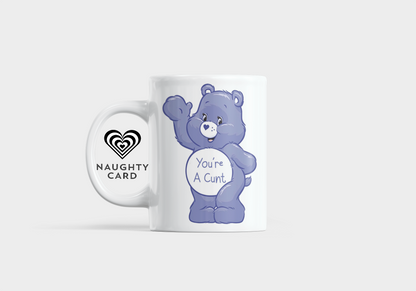 Mug with a purple bear character and text "Youre a cunt" on a white background