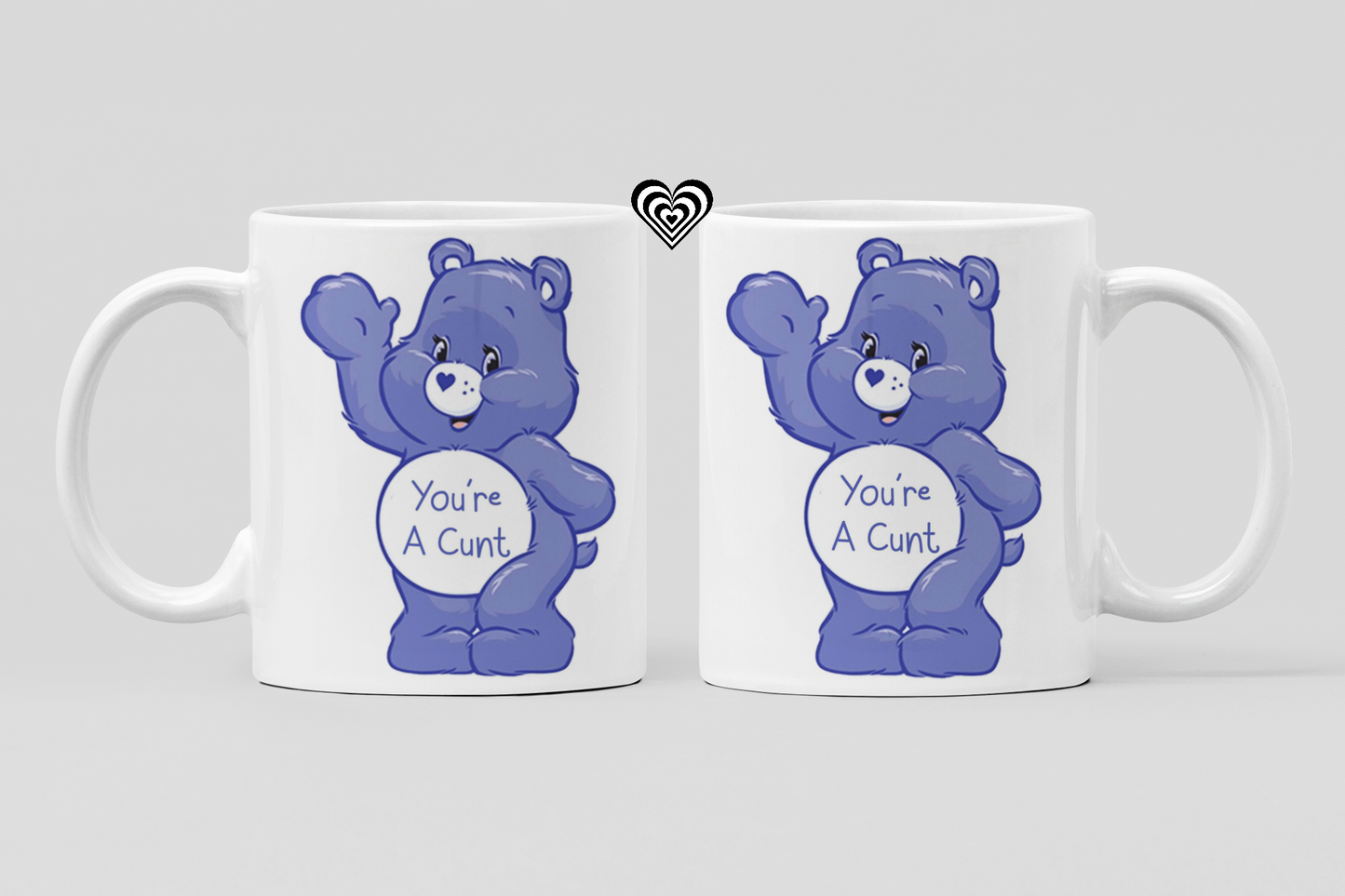 Two mugs with blue bears and offensive text on a light gray background