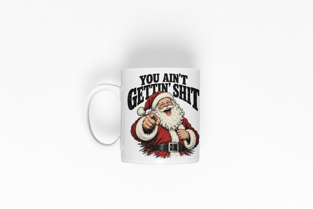 A white ceramic mug featuring a graphic of a pointing Santa Claus and the bold text 'YOU AIN'T GETTIN' SHIT' on a clean white background.