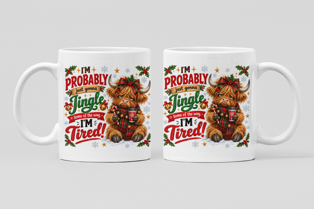 Two white ceramic mugs with a festive Christmas Highland cow graphic, shown side-by-side against a neutral light gray background.